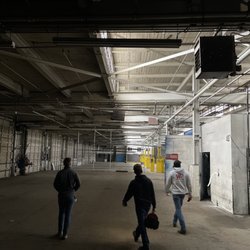Washington Asbestos Testing - Ben (center), one of our AHERA certified building inspectors conducting a survey on a commercial property.