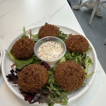 Hamsa - Falafel (5 pieces) (V, GF)...moist on the inside, crispy on the outside served with tahini sauce - Arabic Near Me - Seattle, Washington Hamsa - Falafel (5 pieces) (V, GF)...moist on the inside, crispy on the outside served with tahini sauce - Arabic Near Me - Seattle, Washington