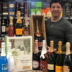 Wine Dock Liquor & Deli - Ronnie with some of our champagne selection.