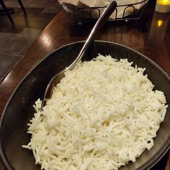 Nawab Indian Cuisine - A bowl of white rice and a basket with the Garlic Naan. - Indian Near Me - Roanoke, Virginia Nawab Indian Cuisine - A bowl of white rice and a basket with the Garlic Naan. - Indian Near Me - Roanoke, Virginia