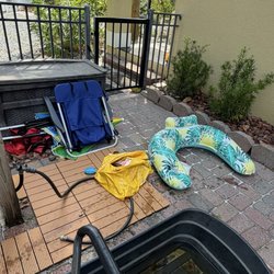 Beach Blue Properties - Busted and broken floats, chairs and umbrellas. These were not picked up even after maintenance came 2 days later to clean the pool.
