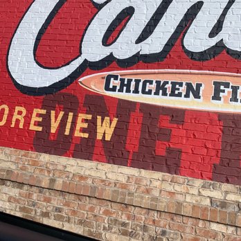 Raising Cane's Chicken Fingers - a sign on a brick wall - American Near Me - Shoreview, Minnesota Raising Cane's Chicken Fingers - a sign on a brick wall - American Near Me - Shoreview, Minnesota