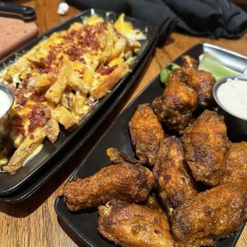 Outback Steakhouse - Aussie cheese fries. And Kookaburra Wings® - Steakhouses Near Me - Burbank, California