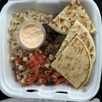 Freska Mediterranean Grill - Steak Plate with brown rice, Greek Pasta. Salad, tomato cucumber salad,  Roasted Pepper Aioli, and warm pita bread. - Mediterranean Near Me - Middleton, Wisconsin