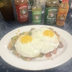 Rise N Dine - Judy's Hash with eggs on top and the selection of hot sauces they brought out. Really good.