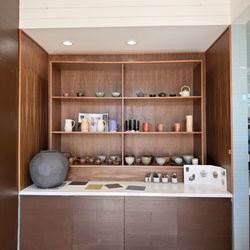 Favorite Coffee Museum - Another wall with handmade pottery, right next to the counter and the restrooms