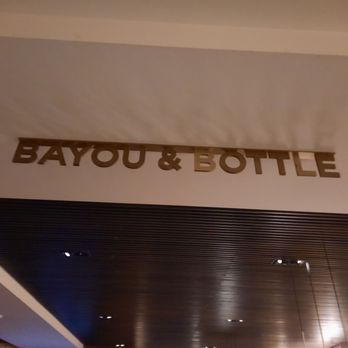 Bayou & Bottle - Signage at the bar - New American Near Me - Houston, Texas