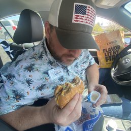 My friend Nathan is enjoying his spicy chicken My friend Nathan is enjoying his spicy chicken