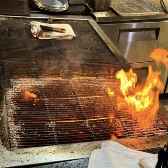 Burwell's Stone Fire Grill - Steaks are cooked over an open flame - New American Near Me - Charleston, South Carolina Burwell's Stone Fire Grill - Steaks are cooked over an open flame - New American Near Me - Charleston, South Carolina