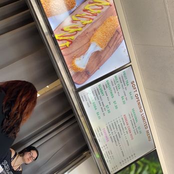 Dessert Lounge - a woman standing in front of a display of donuts - Fast Food Near Me - Watsonville, California Dessert Lounge - a woman standing in front of a display of donuts - Fast Food Near Me - Watsonville, California