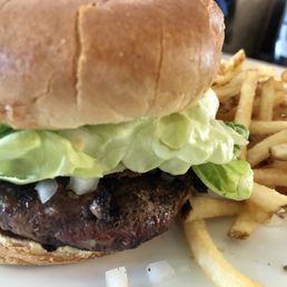 Grass-fed burger and fries, only $9 on the happy hour menu
