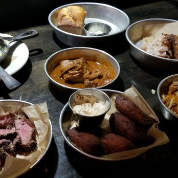 Work & Class - Top lt w/spoon - mac n cheese Top ctr-jalapeno cornbread Top rt-cajun chicken Ctr-brisket Bot lt-lamb Bot ctr-plaintains Bot rt-Pibil - New American Near Me - Denver, Colorado