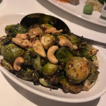 Eddie V's Prime Seafood - Honey Sriracha Roasted Brussels Sprouts with Cashews - Seafood Near Me - Austin, Texas Eddie V's Prime Seafood - Honey Sriracha Roasted Brussels Sprouts with Cashews - Seafood Near Me - Austin, Texas