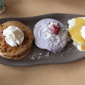 My Cafe - Flight of pancakes: cookie butts luva, choco taro Haupia, lilikoi...DELICIOUS - Breakfast & Brunch Near Me - Kapolei, Hawaii