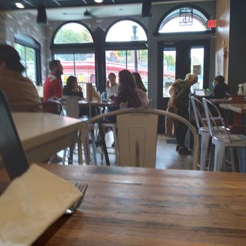 The Hidden Pig - people sitting at tables in a restaurant - Burgers Near Me - Haverhill, Massachusetts