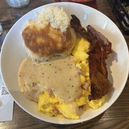 Power Bowl with bacon, biscuit, gravy, ham, eggs, cheese grits!! This will definitely be two or three meals for me! Power Bowl with bacon, biscuit, gravy, ham, eggs, cheese grits!! This will definitely be two or three meals for me!