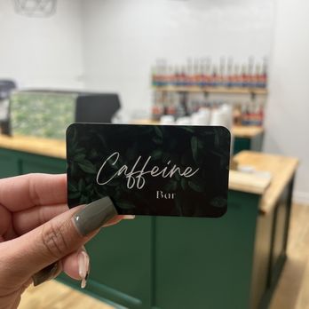 Caffeine Bar - a person holding up a card - Coffee & Tea Near Me - Richland, Washington Caffeine Bar - a person holding up a card - Coffee & Tea Near Me - Richland, Washington