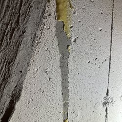 A-1 Foundation Crack Repair - yellow overflow had to be chiseled off, damaging paint.