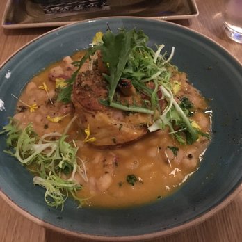 Woven + Bound Restaurant - Braised Pork Shank 36 pancetta, stewed white beans, grilled chicory, pepita gremolata - Bars Near Me - Chicago, Illinois
