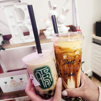 A Tea 7 - a person holding a cup of iced coffee - Bubble Tea Near Me - San Diego, California