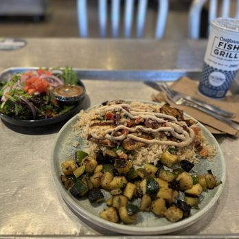 California Fish Grill - Mahi mahi Mediterranean style with white rice and diced rosemary zucchini - Seafood Near Me - Redlands, California California Fish Grill - Mahi mahi Mediterranean style with white rice and diced rosemary zucchini - Seafood Near Me - Redlands, California