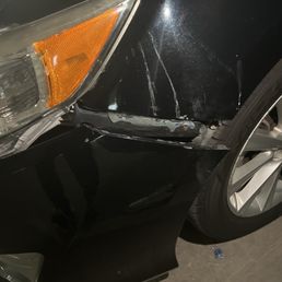 Car front bumper falling off after repair with what looks like glue. Car front bumper falling off after repair with what looks like glue.