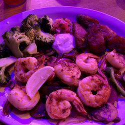 Tijuana Taxi Co - Grilled shrimp on a bed of sautéed onions, mushrooms and peppers, with 2 sides: maduros and garlic broccoli --- yummy!!!