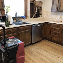 Paul Davis Restoration - Over 950 to take 2 cabinets off the and cut that hole. That's their dehumidifier