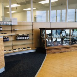 Custom Med Apothecary - Additional supplements and some cool antiques in the cabinet to the right