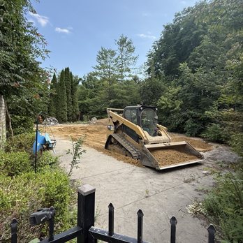 Pool Busters - Skid loader filling and compressing sand in pool hole - Demolition Services Near Me Pool Busters - Skid loader filling and compressing sand in pool hole - Demolition Services Near Me
