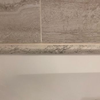 Grout Guru NYC - a bathtub with a drain - General Contractors Near Me Grout Guru NYC - a bathtub with a drain - General Contractors Near Me