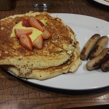 First Watch - Lemon ricotta pancakes with lemon curd and strawberries and a side order of turkey sausage links - Breakfast & Brunch Near Me - Hermitage, Tennessee