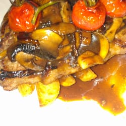Settlers Run Golf & Country Club - Porterhouse steak with hand cut oven baked chips and truss tomato wirh mushroom ragout...baked pumpkin as a side