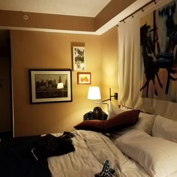 Hotel Lincoln - Queen bed.. notice the sliding bathroom door off kilter - Hotels Near Me - Chicago, Illinois Hotel Lincoln - Queen bed.. notice the sliding bathroom door off kilter - Hotels Near Me - Chicago, Illinois