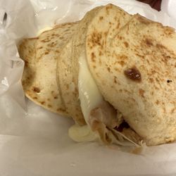 Gordita with beans and cheese. Usually come with lettuce, tomato, sour cream. Order without or it'll get soggy.