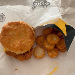Chicken biscuit and small hash rounds. Chicken biscuit and small hash rounds.