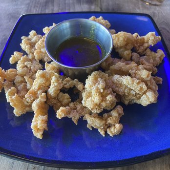 Scotty's Front Street Stage - Cracked Conch appetizer with Colombo curry sauce. Very nice! - Seafood Near Me - Key West, Florida Scotty's Front Street Stage - Cracked Conch appetizer with Colombo curry sauce. Very nice! - Seafood Near Me - Key West, Florida