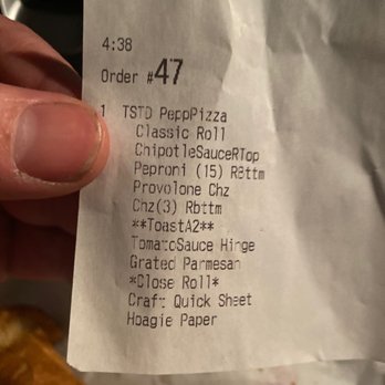 Wawa - a person holding a piece of food - Convenience Stores Near Me - Richmond, Virginia Wawa - a person holding a piece of food - Convenience Stores Near Me - Richmond, Virginia