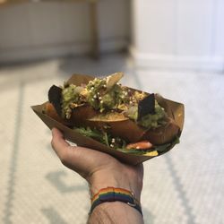 Vegan Bowls - El Moro, vegan supersandwich on pretzel bun and a bed of chips. Yummy