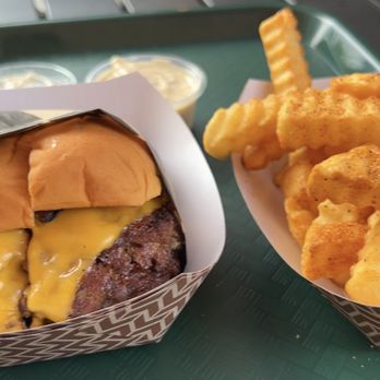 The Burch x Boathouse - a cheeseburger and fries on a tray - New American Near Me - Greensboro, Georgia The Burch x Boathouse - a cheeseburger and fries on a tray - New American Near Me - Greensboro, Georgia