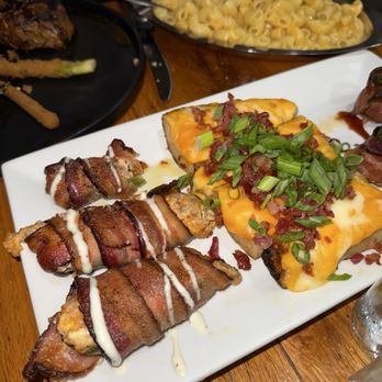 Tex-Ken Ranch - TCM Poppers (Jalapeño Poppers), Potato skins, and the spicy beef bombs. Mac n cheese in the back of the photo. - Steakhouses Near Me - Stephenville, Texas