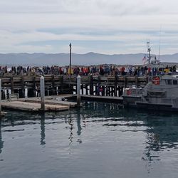 Lighted Boat Parade - Parade viewers lining up early on the USCG T Pier for the Morro Bay Lighted Boat Parade