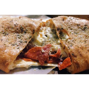 Westgate Pizza Bella - The calzones are huge and definitely enough to split among a few people. This one pictured had ricotta, mozzarella and pepperoni in it! - Pizza Near Me - Albany, New York Westgate Pizza Bella - The calzones are huge and definitely enough to split among a few people. This one pictured had ricotta, mozzarella and pepperoni in it! - Pizza Near Me - Albany, New York