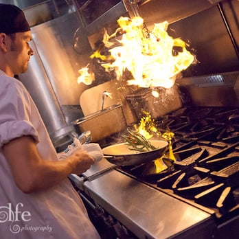 J Gilbert's - Sean Derickson, saute chef, shows off his skills with the green beans and pecans. - Seafood Near Me - Des Pers, Missouri J Gilbert's - Sean Derickson, saute chef, shows off his skills with the green beans and pecans. - Seafood Near Me - Des Pers, Missouri