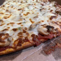 Suzy's Pizza - Combo pizza has it piled on.