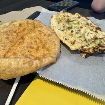 Fusion Indian Cuisine - Bhatura on the left, garlic naan on the right - Indian Near Me - Clovis, California Fusion Indian Cuisine - Bhatura on the left, garlic naan on the right - Indian Near Me - Clovis, California