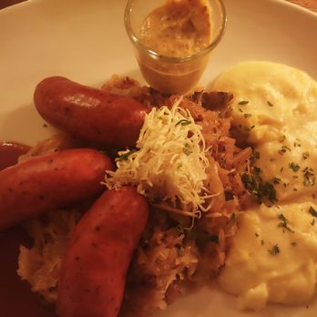 Wirtshaus in der Au - Auer Bauernwurstl: well seasoned spicy sausages with sauerkraut, mashed potatoes, and homemade mustard. - German Near Me - Munich, BY Wirtshaus in der Au - Auer Bauernwurstl: well seasoned spicy sausages with sauerkraut, mashed potatoes, and homemade mustard. - German Near Me - Munich, BY