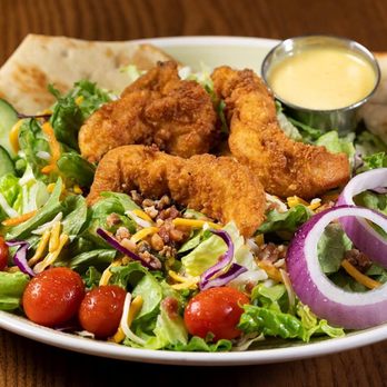 99 Restaurants - a plate of food with a salad - Pubs Near Me - Littleton, New Hampshire
