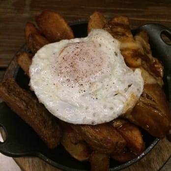Bosscat Kitchen & Libations - Pork Belly Poutine with Cheese Curds! (Secret Recipe Fries, All Natural Pork Belly, Cheese Curds, Gravy & Duck Fat Fried Egg) - New American Near Me - Irvine, California