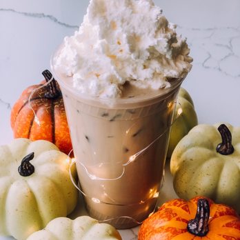 Baristo Cafe Bar - a cup of coffee with whipped cream and pumpkins - Breakfast & Brunch Near Me - Foxborough, Massachusetts